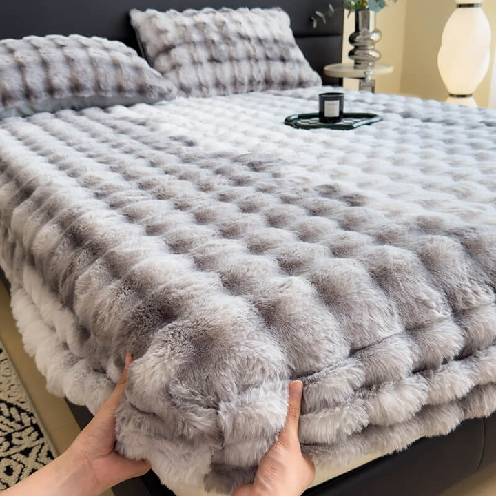 Plush faux rabbit fur fitted mattress protector in gray, close-up texture
