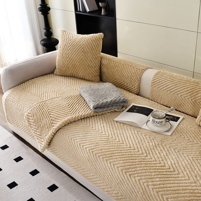Close-up of plush herringbone texture on a non-slip sofa protector, easy clean fabric