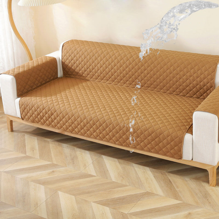 A child and pet playing on a sofa with a waterproof velvet non-slip sofa cover protecting the furniture.