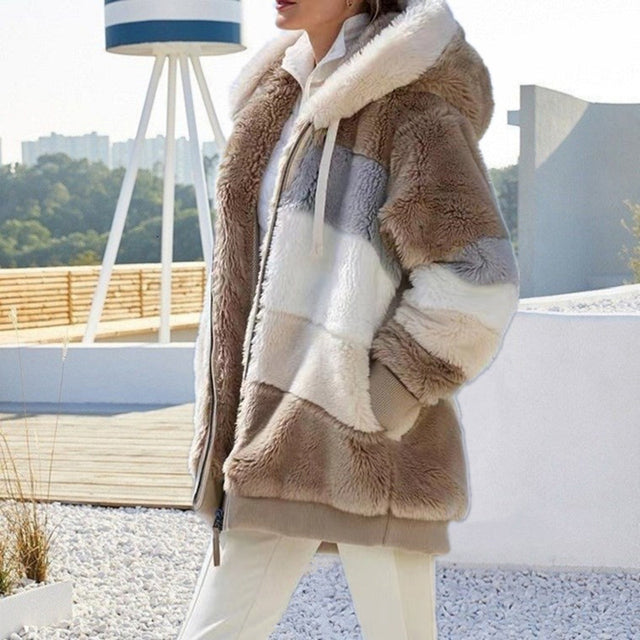 Stylish women's winter coat made from soft plush material. Warm and cozy ladies' jacket, great for cold days.