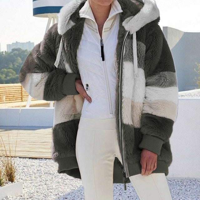Plush women's winter jacket in a stylish cut. Cozy outerwear for women, offering comfort and warmth in cold seasons.
