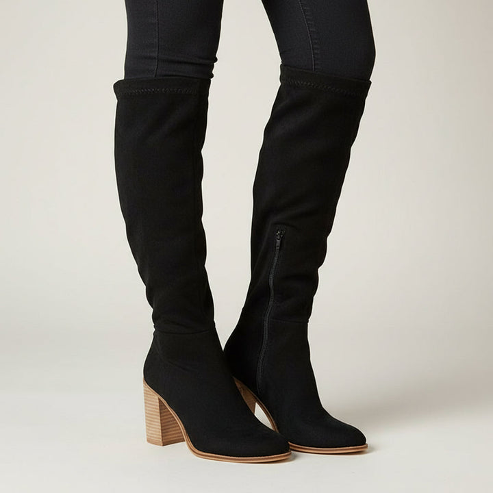 Versatile women's knee-high fashion boots with block heel, pointed toe, and side zipper for chic winter style.