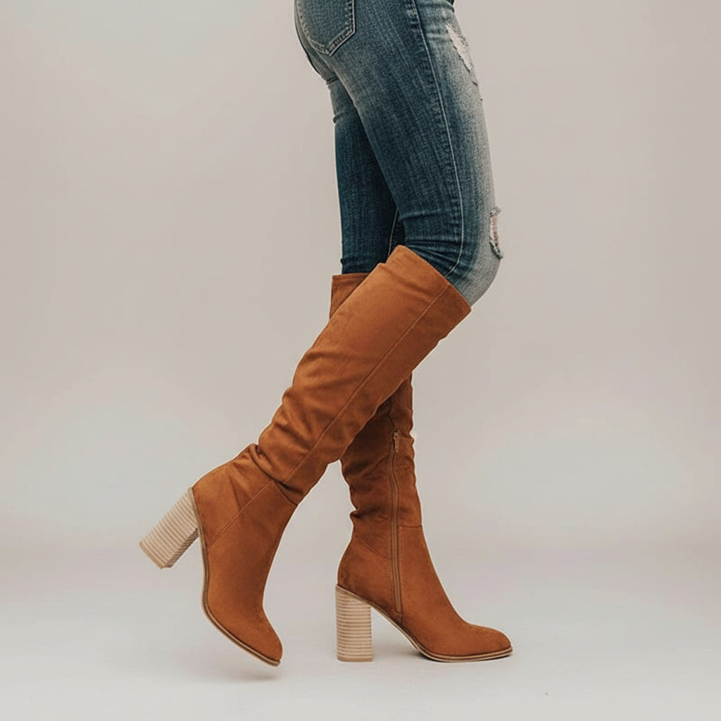 Women's comfortable knee-high block heel boots with pointed toe and side zipper for elegant fall/winter fashion.