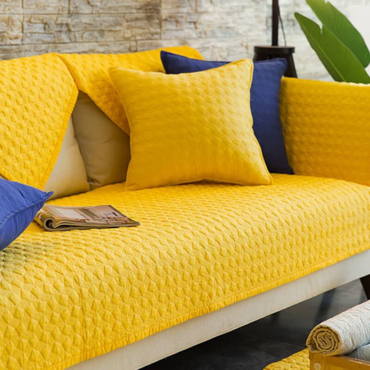 Pet-friendly quilted anti-slip sectional cover, ensuring furniture protection and stability on any sofa