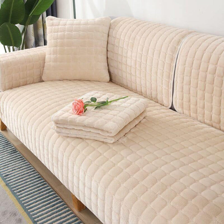 Beige flannel sofa cover, anti-slip, quilted, scratch-resistant, protecting furniture from pets.