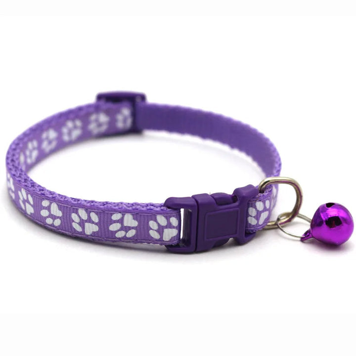 Black adjustable pet bowtie collar with a silver bell, sleek quick release design for small dogs.