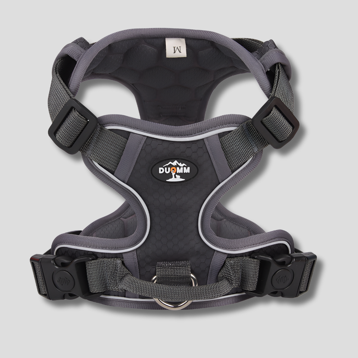 Black pet dog harness, adjustable and breathable, with reflective straps for night safety.