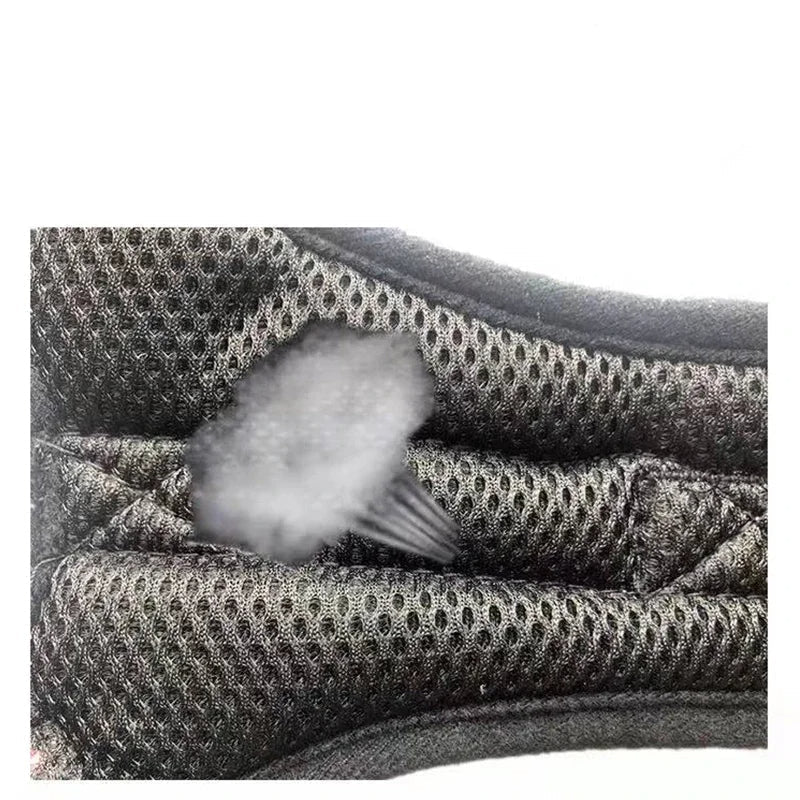 Close-up of an adjustable no-pull dog harness, highlighting reflective stitching for night safety.