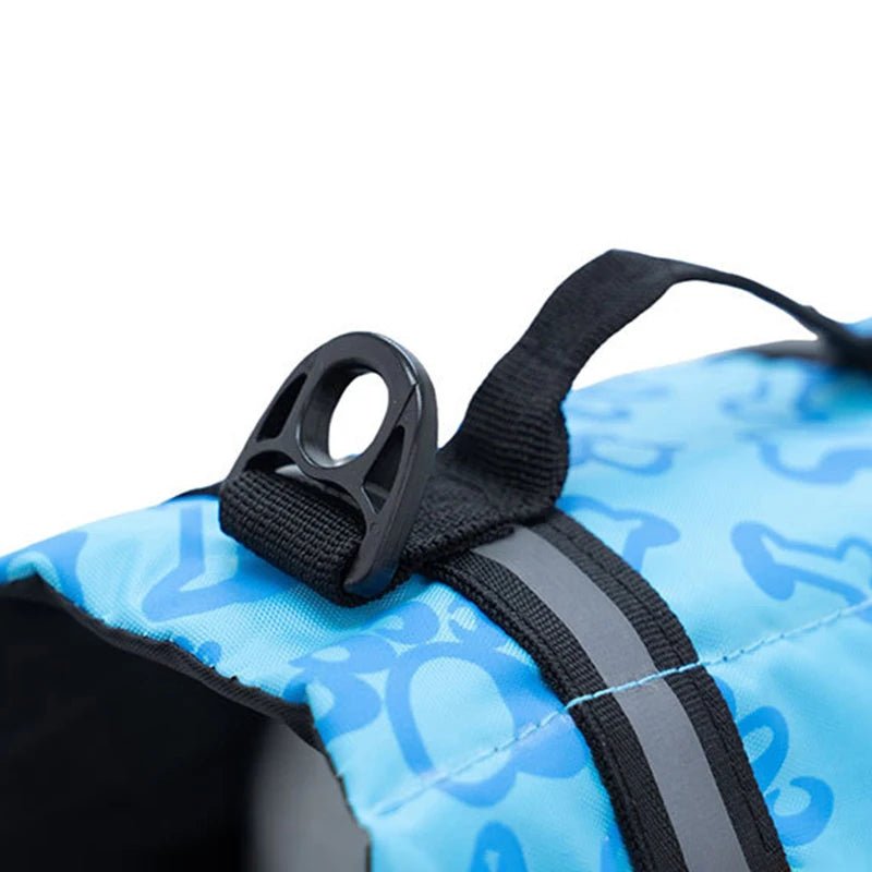 Close-up of reflective dog life vest material, showcasing durable fabric and strong buckles.
