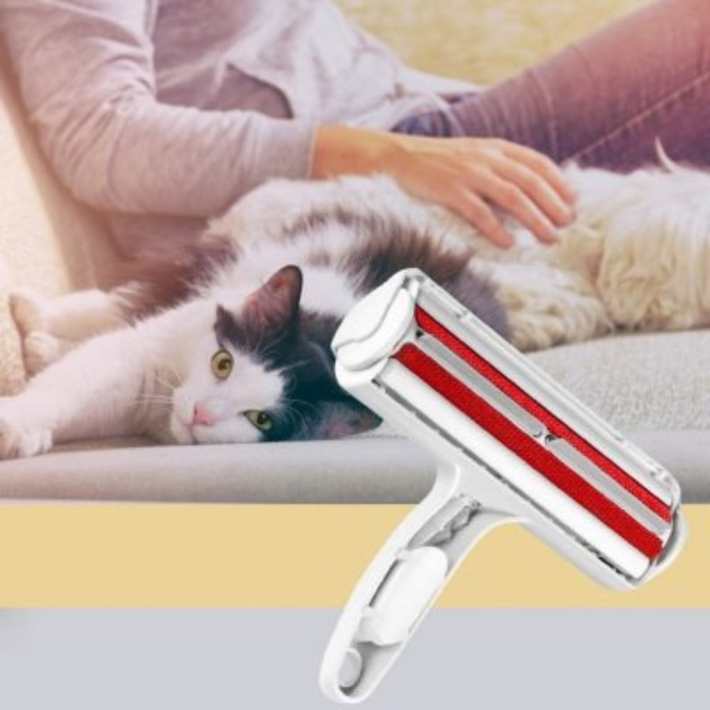Reusable pet hair remover roller, red & white, on a wooden floor, effective for fur removal