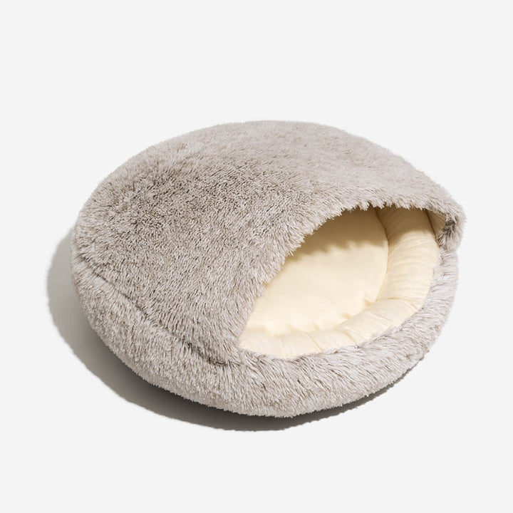 Luxury plush cat bed, semi-enclosed design offers calming anxiety relief for pets.