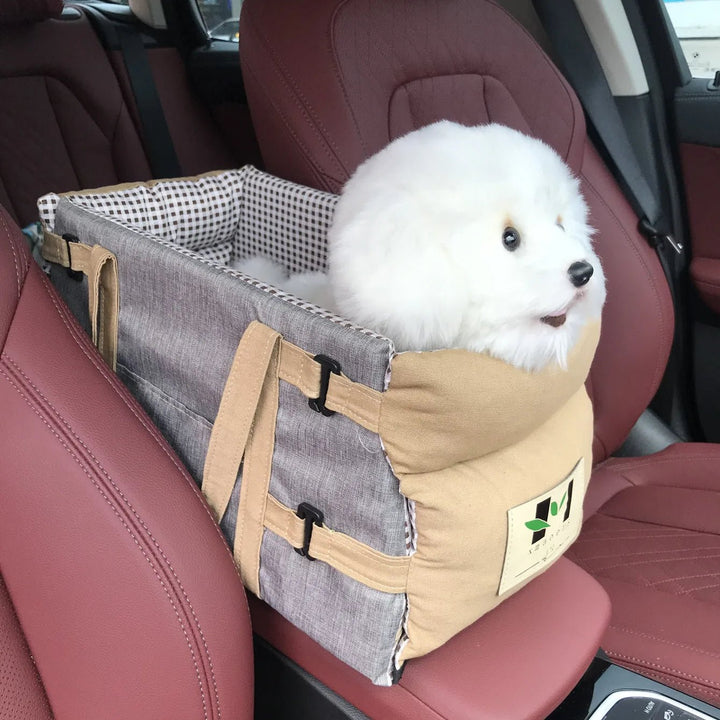 Small dog car seat carrier with breathable mesh for safe, comfortable pet travel, secured in a car.