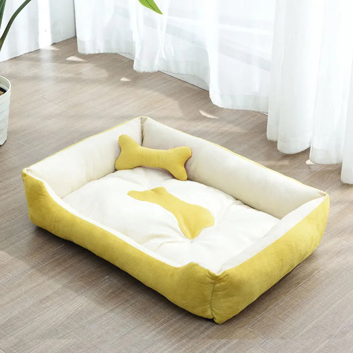 Close-up of the soft fabric and bone pillow of a small pet calming bed, designed for anxious pets.