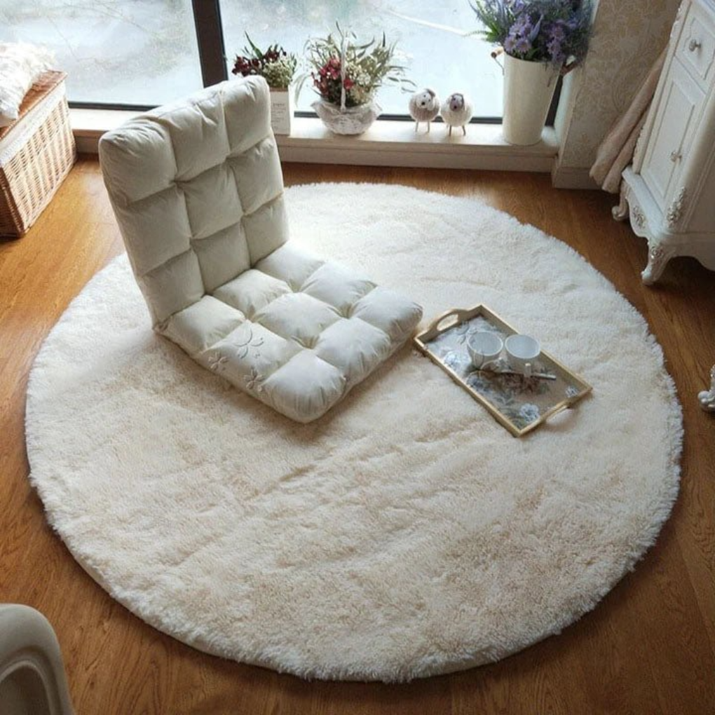 White faux fur fluffy round rug, perfect soft circular mat for cozy living room.