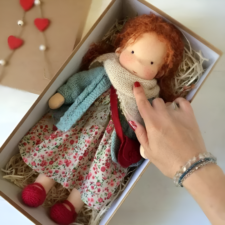 Cuddly wool Waldorf doll, a handmade imaginative toy offering comfort to children.