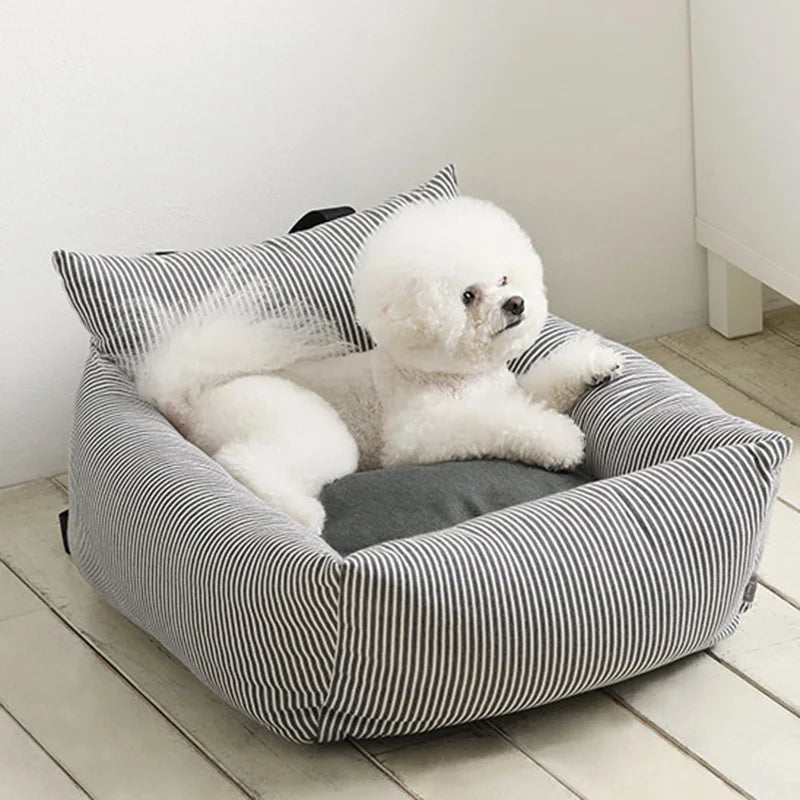 Portable pet travel carrier for small dogs, airline compliant with secure zippers.