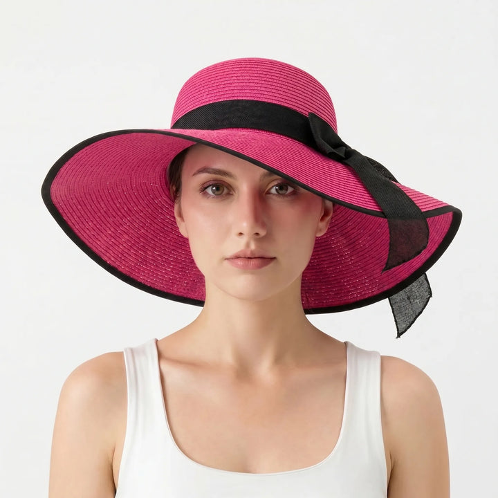 Women's wide brim floppy sun hat with ribbon detail. Offers great UV protection, packable for travel & beach days.