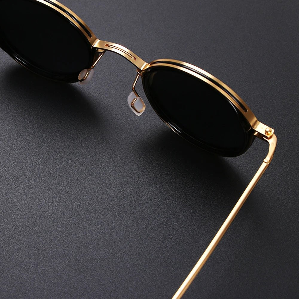 Durable unisex polarized round sunglasses featuring metal temples & sun protection for all.