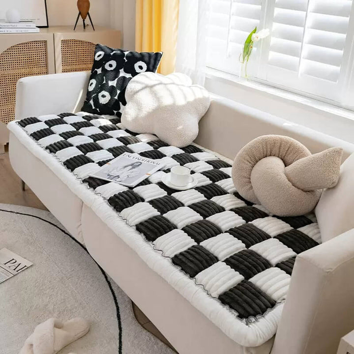 Pet blanket draped over a sofa, blending as home decor while offering pet comfort