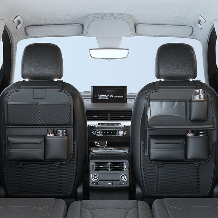Car backseat organizer, black, with a sturdy foldable tray and multiple storage pockets for travel
