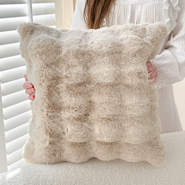 Stylish plush faux fur sofa cover in a modern interior, providing pet protection and warmth