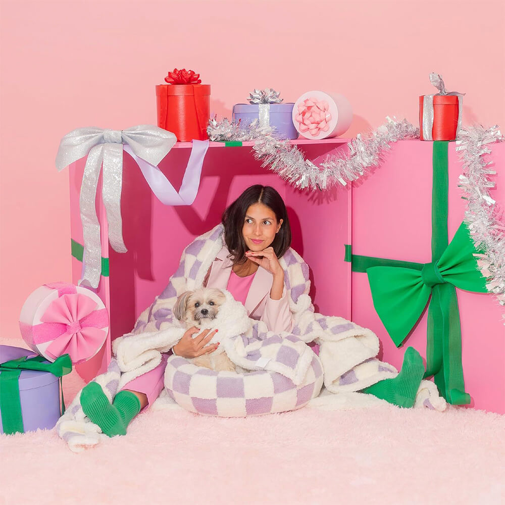 Versatile pet blanket, waterproof with sherpa fleece, functioning as a dog mat or furniture cover.