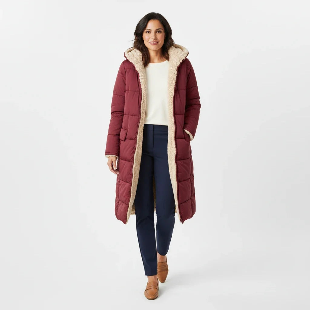 Elegant women's hooded winter coat, a warm and stylish oversized puffer jacket.