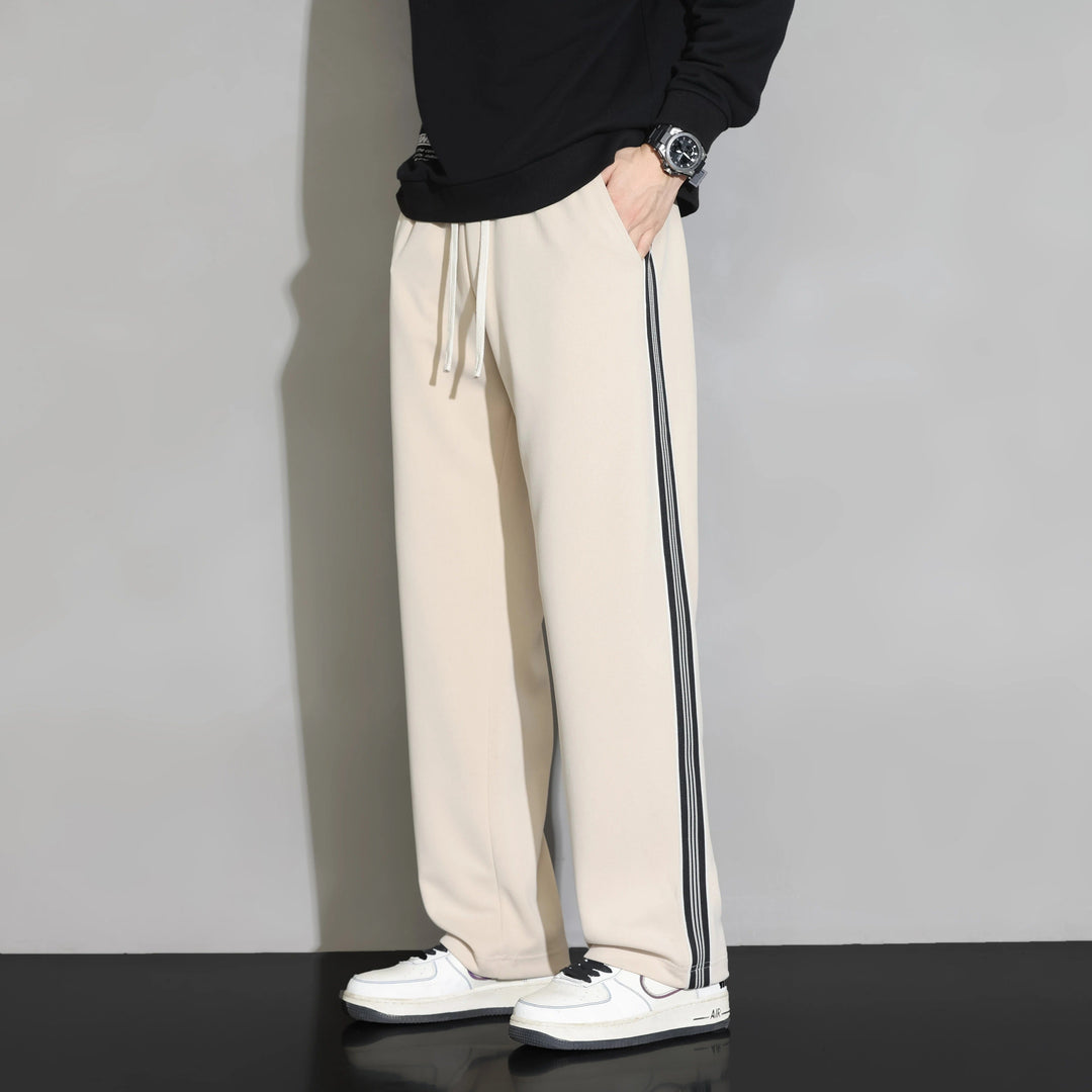 Soft polyester men's joggers, relaxed fit, with comfortable drawstring waist for leisurewear.