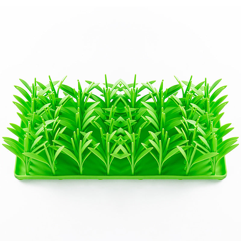 Vibrant green silicone pet feeding mat with grass design, non-slip base for dog or cat bowls
