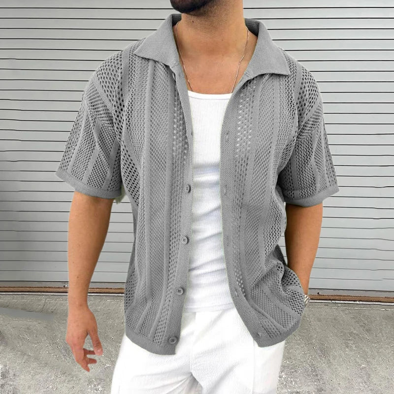 Comfortable men's casual top with a hollow knit, short sleeves, and relaxed fit, great for warm weather.
