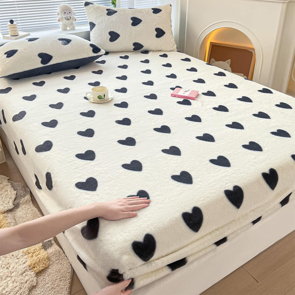 Milk velvet fitted sheet with two pillowcases, showcased on a neatly made bed for comfort.