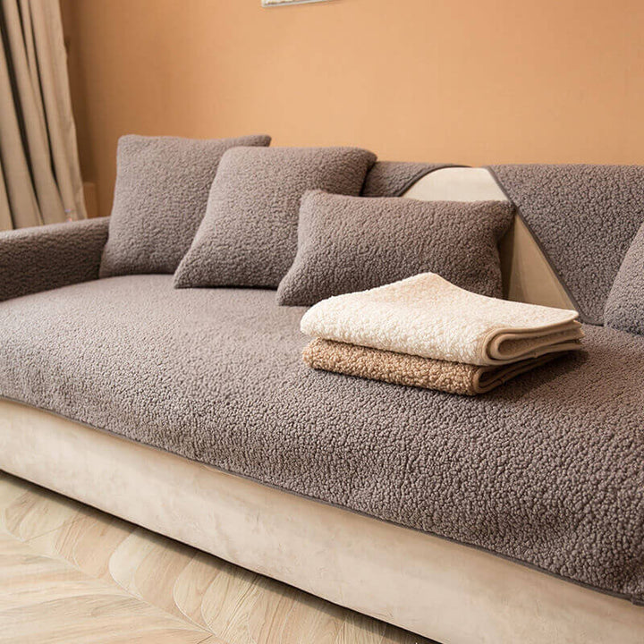 Soft cream teddy fleece couch cover, non-slip design, protecting a sofa, winter home essential.