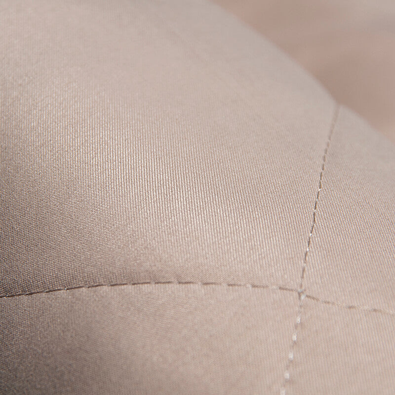 Dog car seat cover folded into a travel bed, portable pet accessory