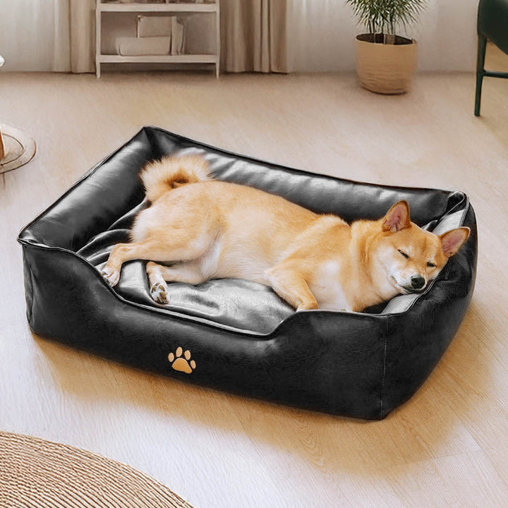 Side profile of a waterproof faux leather dog sofa bed, elevated pet furniture offering comfort and support