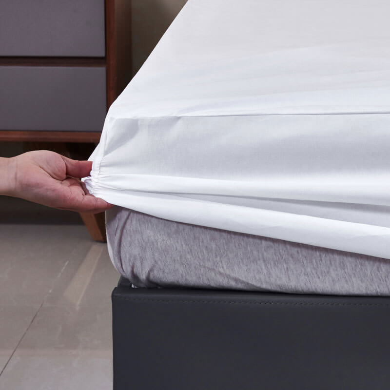Waterproof fitted sheet set in soft fabric, protecting mattress from spills & stains, easy care bedding.