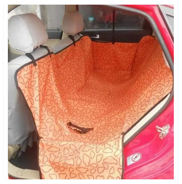 Close-up of the waterproof and non-slip fabric of a black pet car seat cover, showing durable material.