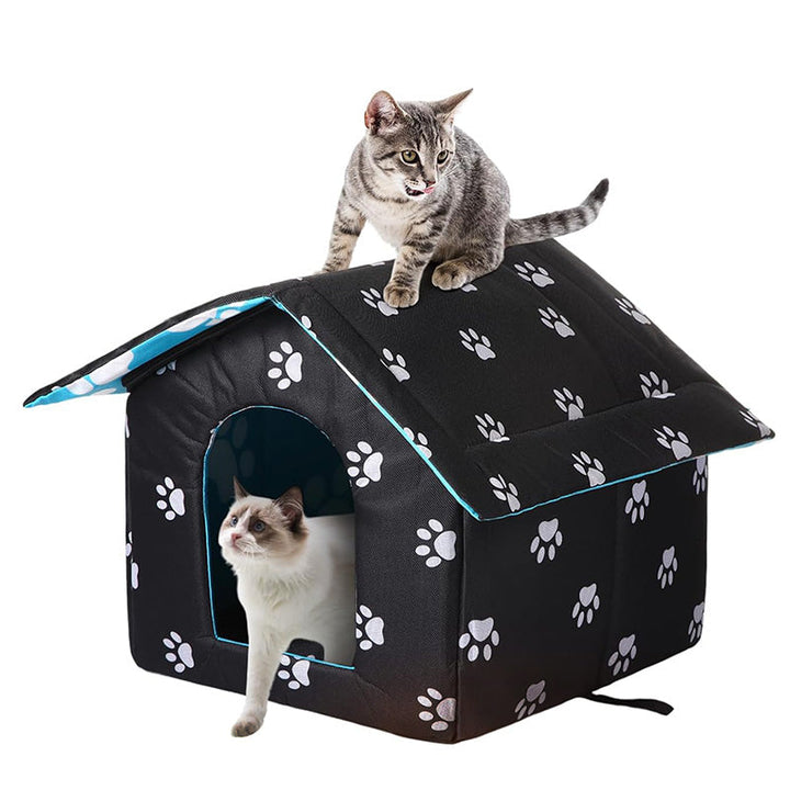 Weatherproof outdoor pet shelter with self-warming pad for cats, small dogs, and feral cats.