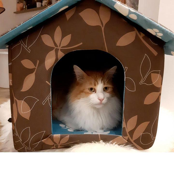 Feral cat outdoor shelter, insulated with a self-warming pad for chilly nights.