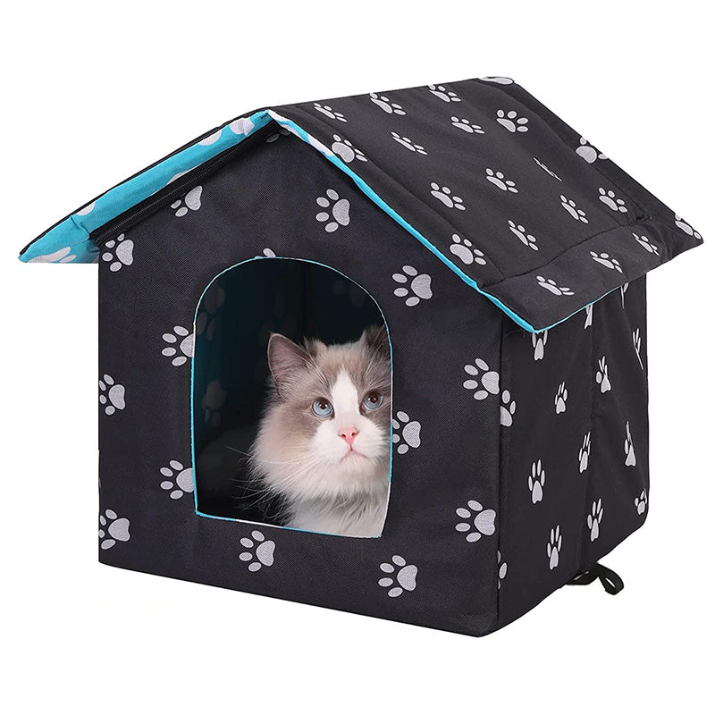 Outdoor cat house with self-warming pad, durable and weatherproof for all seasons.