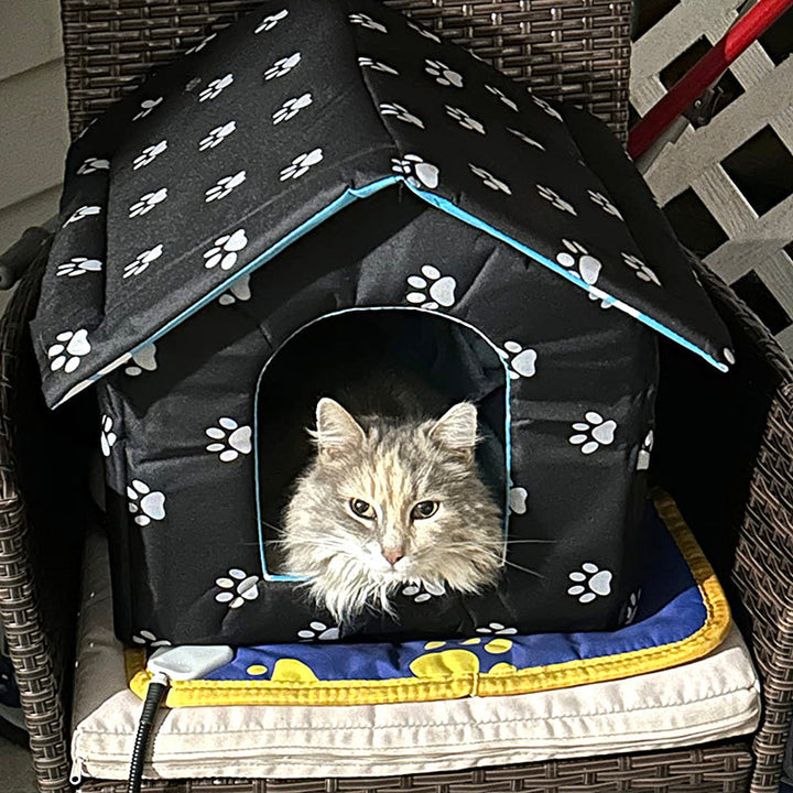 Weatherproof pet bed and outdoor shelter for cats, keeping them warm and dry.
