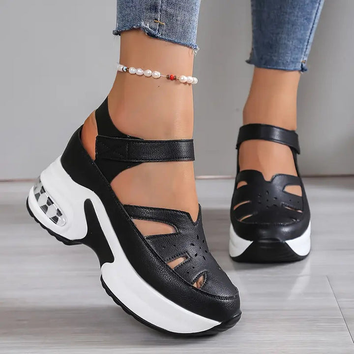 Black women's comfortable platform wedge sandals, featuring a breathable cutout design and Mary Jane style.