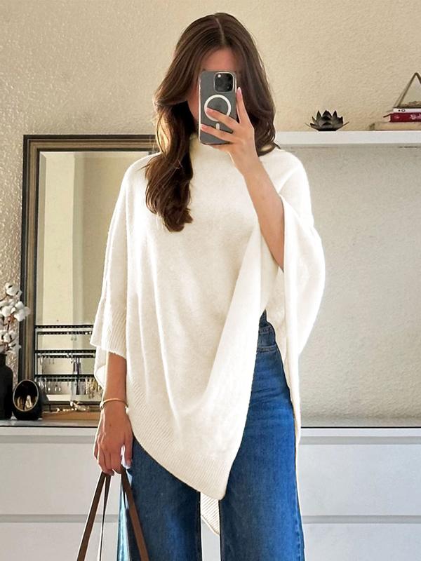Soft wool blend women's poncho. Effortless, oversized knitwear with an asymmetric design for chic fall & winter.
