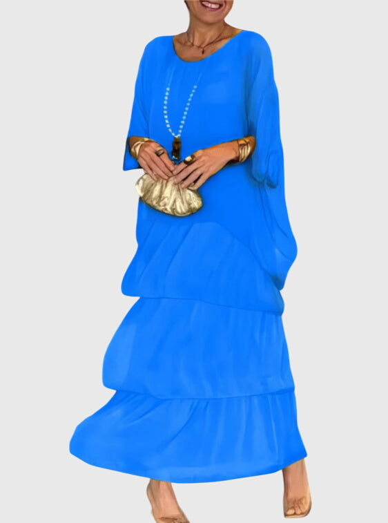Flowy women's abstract print tiered maxi dress, perfect for bohemian summer and festival look.