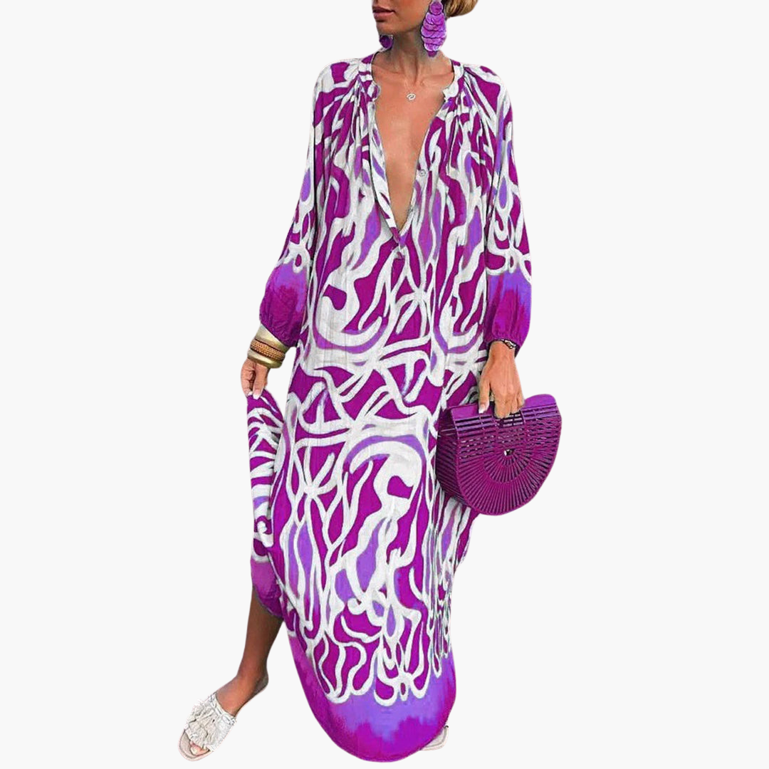 Loose-fit women's abstract print V-neck maxi dress. Comfortable long sleeve resort wear & beach cover-up.
