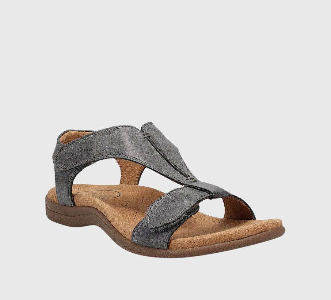 Comfortable women's T-bar sandals with orthopedic arch support. Adjustable straps, ideal for everyday wear.