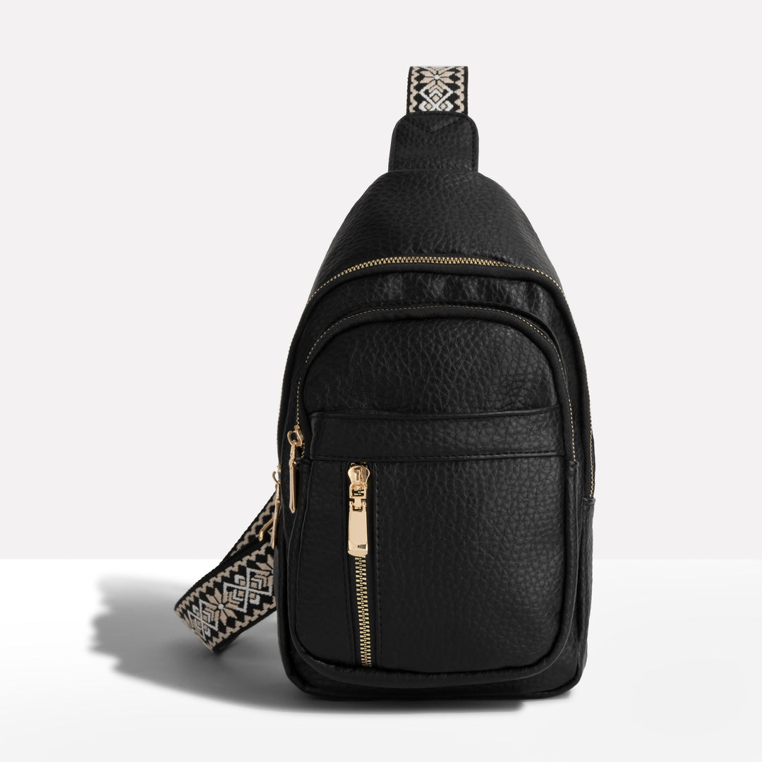 Women's anti-theft sling bag, ideal for travel. Features a stylish patterned strap & secure design for valuables.