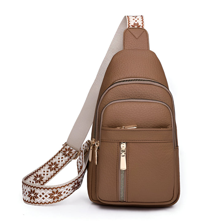 Secure women's anti-theft shoulder bag with elegant patterned strap. A fashionable and practical choice for travel.
