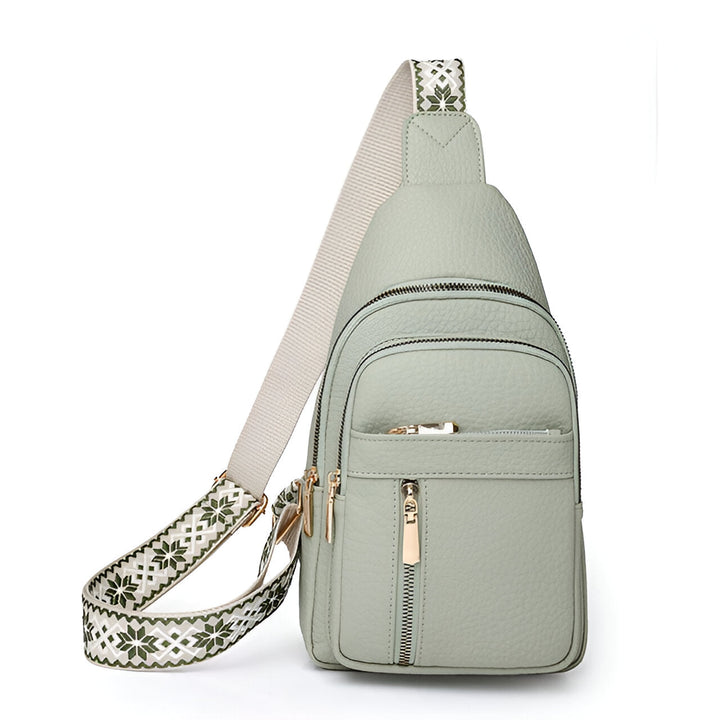 Practical women's anti-theft travel sling bag. Designed with a secure compartment & trendy patterned adjustable strap.
