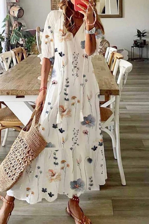 Women's boho floral print V-neck maxi dress with tassels, ideal for summer vacation or casual spring wear.
