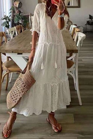 Stylish women's floral print V-neck maxi dress with tassel accents, a breezy boho casual dress for spring and summer.